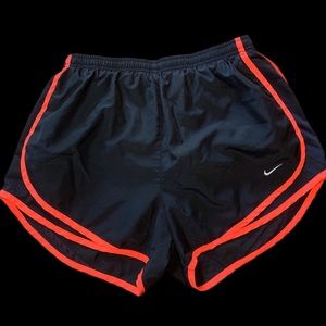 Black and coral women’s size medium Nike running shorts
